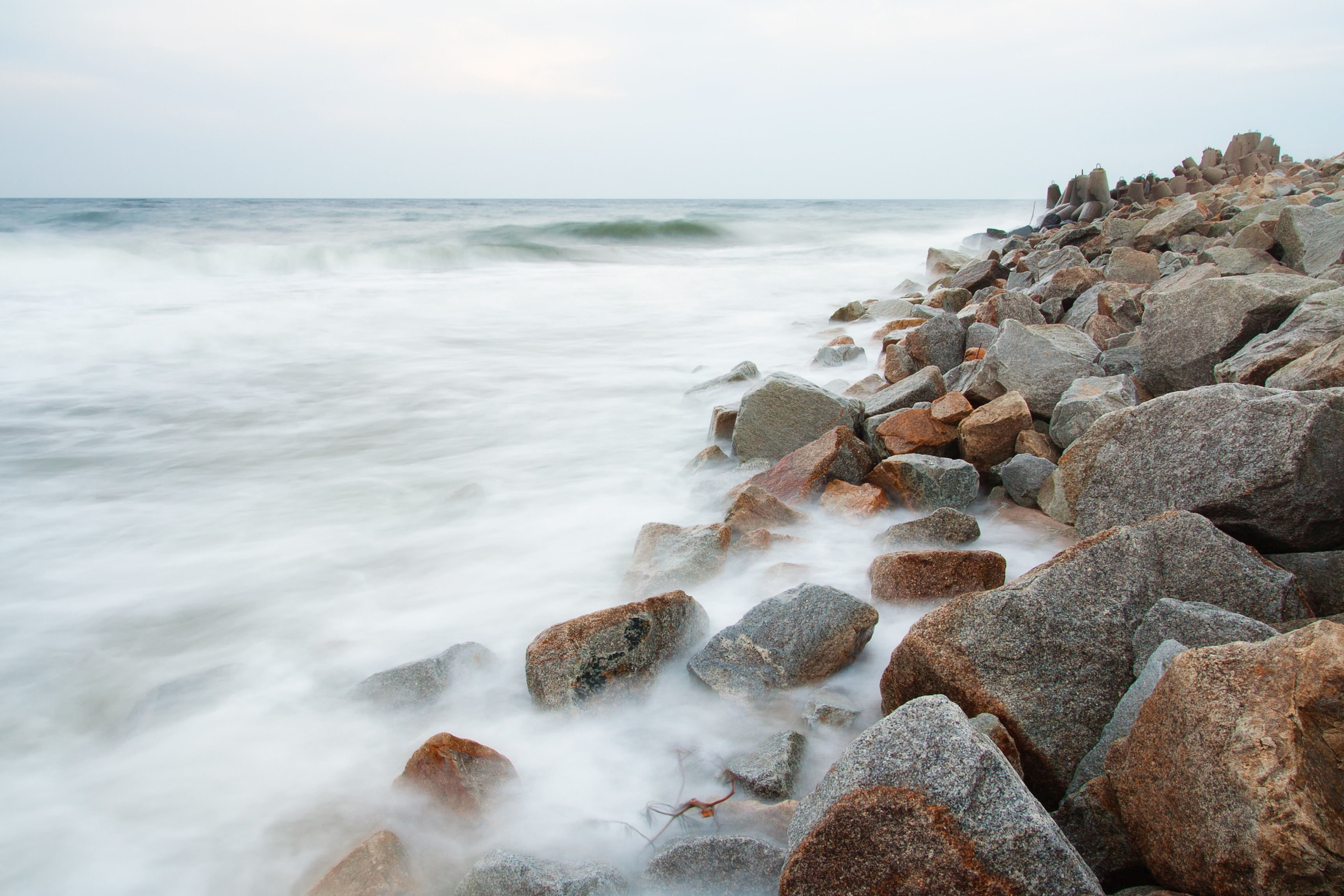 stone-breakwater-photographed-on-long-exposure-sbi-300870579.jpg